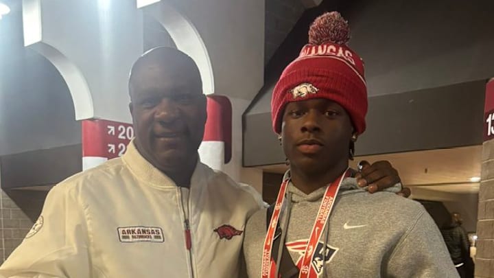 Arkansas running backs coach David Johnson with Marion running back Jeremiah Dent at Razorbacks Junior Day.