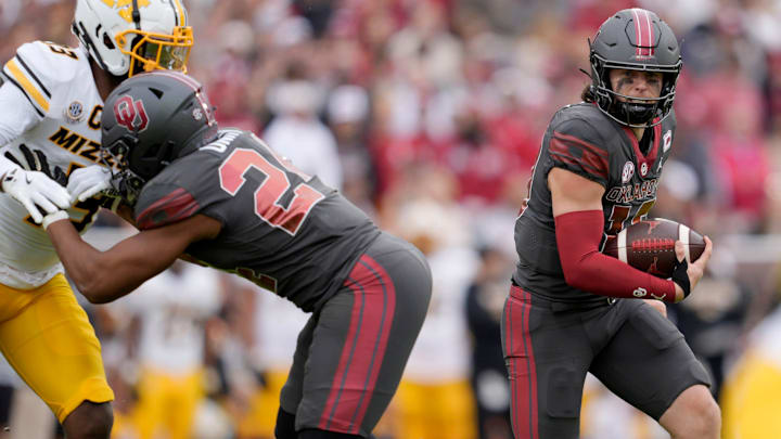 Oklahoma quarterback John Mateer carries the ball in the Sooners' win over Missouri.
