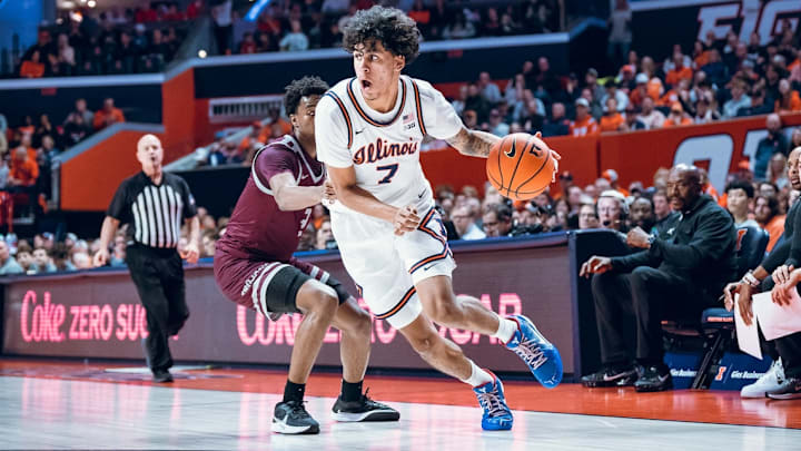 Illinois freshman forward Will Riley (7) drives on a defender in the Illini's 92-34 win over Little Rock on Monday at the State Farm Center in Champaign, Illinois.