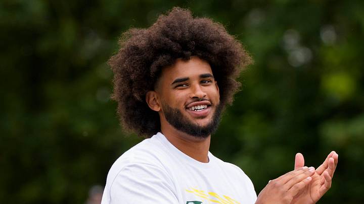 Oregon quarterback Dante Moore celebrates after a reception during a youth football camp at Marist Catholic High School on June 20, 2026, in Eugene, Oregon. Oregon quarterback Dante Moore celebrates after a reception during a youth football camp at Marist Catholic High School on June 20, 2026, in Eugene, Oregon.