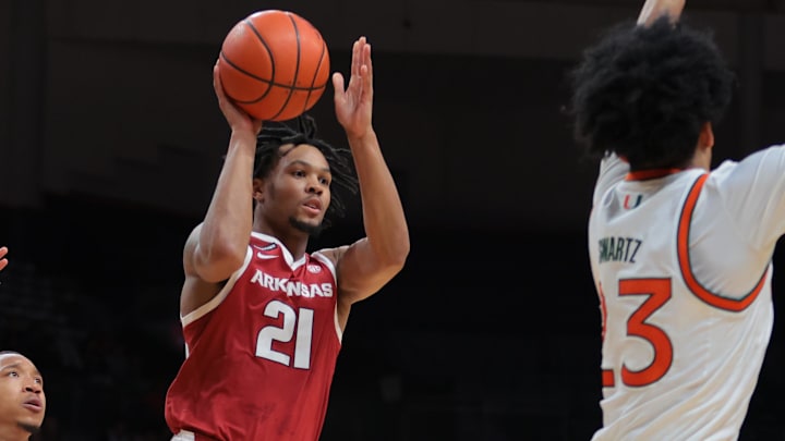 Arkansas Razorbacks guard D.J. Wagner (21) penetrates the Miami defense before passing during the first half at Watsco Center in Coral Gables, Fla. Wagner had 14 points and five assists in the 76-73 victory. Arkansas Razorbacks guard D.J. Wagner (21) penetrates the Miami defense before passing during the first half at Watsco Center in Coral Gables, Fla. Wagner had 14 points and five assists in the 76-73 victory.