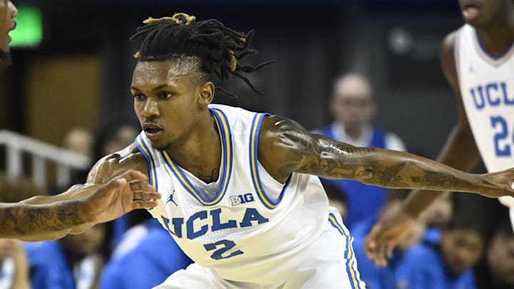 Nov 4, 2024; Los Angeles, California, USA; UCLA Bruins guard Dylan Andrews (2) defends Rider Broncs guard Andre Young (12) during the first half at Pauley Pavilion presented by Wescom. Mandatory Credit: Robert Hanashiro-Imagn Images Nov 4, 2024; Los Angeles, California, USA; UCLA Bruins guard Dylan Andrews (2) defends Rider Broncs guard Andre Young (12) during the first half at Pauley Pavilion presented by Wescom. Mandatory Credit: Robert Hanashiro-Imagn Images