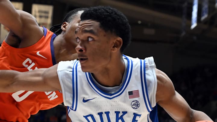 Feb 14, 2026; Durham, North Carolina, USA; Duke Blue Devils guard Caleb Foster (1) controls the ball in front of Clemson Tigers forward RJ Godfrey (0) during the second half at Cameron Indoor Stadium. Mandatory Credit: Rob Kinnan-Imagn Images Feb 14, 2026; Durham, North Carolina, USA; Duke Blue Devils guard Caleb Foster (1) controls the ball in front of Clemson Tigers forward RJ Godfrey (0) during the second half at Cameron Indoor Stadium. Mandatory Credit: Rob Kinnan-Imagn Images