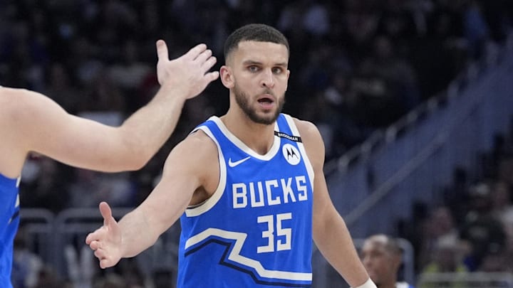 Milwaukee Bucks forward Pete Nance (35) celebrates with Milwaukee Bucks guard Pat Connaughton (24) after making a three point shot against the Detroit Pistons at Fiserv Forum on April 13, 2025.