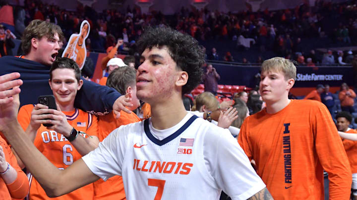 Feb 11, 2025; Champaign, Illinois, USA;  Illinois Fighting Illini forward Will Riley (7) and teammates get a hand from the fans after a win over the UCLA Bruins at State Farm Center. Mandatory Credit: Ron Johnson-Imagn Images