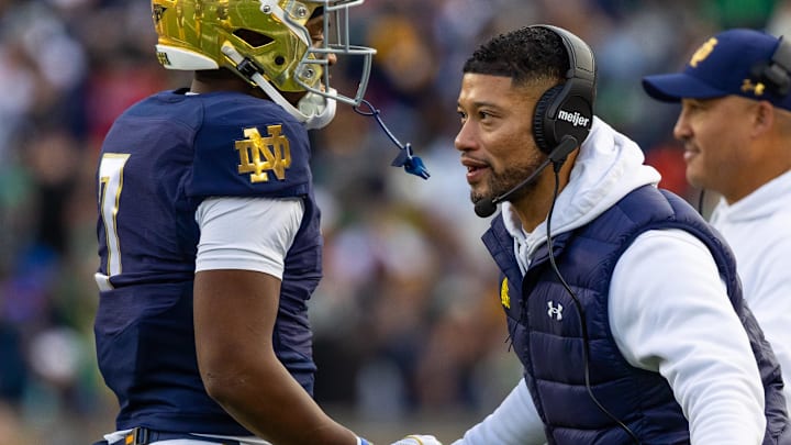 Nov 22, 2025; South Bend, Indiana, USA; Notre Dame Fighting Irish head coach Marcus Freeman celebrates with player after a touchdown against the Syracuse Orange during the first half at Notre Dame Stadium. Mandatory Credit: Michael Caterina-Imagn Images Nov 22, 2025; South Bend, Indiana, USA; Notre Dame Fighting Irish head coach Marcus Freeman celebrates with player after a touchdown against the Syracuse Orange during the first half at Notre Dame Stadium. Mandatory Credit: Michael Caterina-Imagn Images