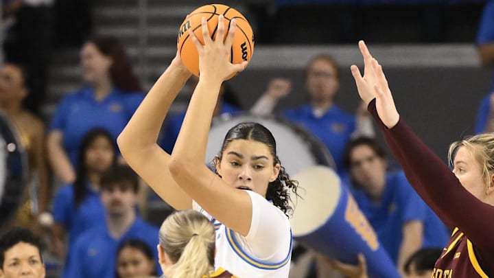 Feb 2, 2025; Los Angeles, California, USA; UCLA Bruins center Lauren Betts (center) is triple teamed on defense by Minnesota Golden Gophers guard Tori McKinney (14), Grace Grocholski (25) and center Sophie Hart (52) during the third quarter at Pauley Pavilion presented by Wescom. Mandatory Credit: Robert Hanashiro-Imagn Images