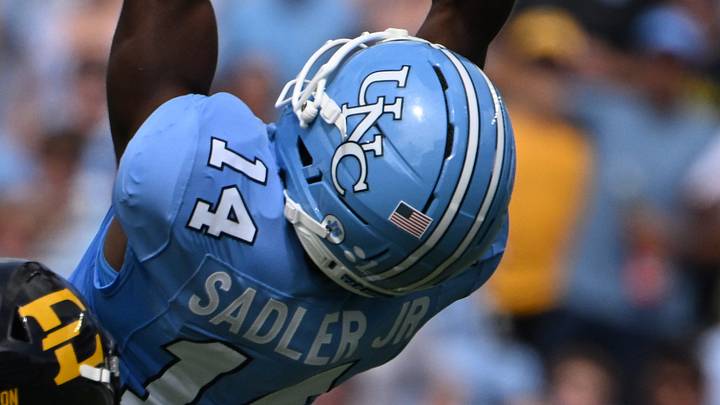 Sep 12, 2026; Chapel Hill, North Carolina, USA; North Carolina Tar Heels wide receiver C.J. Sadler (14) attempts to make a catch as ETSU Buccaneers defensive back CJ Gilmore (15) defends in the first quarter at Kenan Stadium. Mandatory Credit: Bob Donnan-Imagn Images Sep 12, 2026; Chapel Hill, North Carolina, USA; North Carolina Tar Heels wide receiver C.J. Sadler (14) attempts to make a catch as ETSU Buccaneers defensive back CJ Gilmore (15) defends in the first quarter at Kenan Stadium. Mandatory Credit: Bob Donnan-Imagn Images