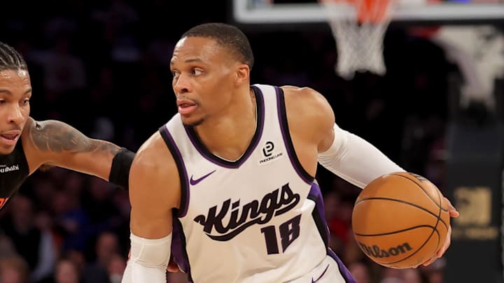Jan 27, 2026; New York, New York, USA; Sacramento Kings guard Russell Westbrook (18) controls the ball against New York Knicks guard Miles McBride (2) during the fourth quarter at Madison Square Garden.