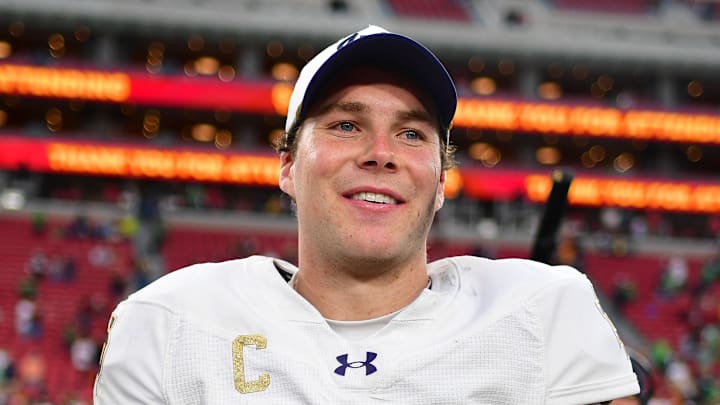 Nov 30, 2024; Los Angeles, California, USA; Notre Dame Fighting Irish quarterback Riley Leonard (13) reacts following the victory against the Southern California Trojans during the second half at the Los Angeles Memorial Coliseum. Nov 30, 2024; Los Angeles, California, USA; Notre Dame Fighting Irish quarterback Riley Leonard (13) reacts following the victory against the Southern California Trojans during the second half at the Los Angeles Memorial Coliseum.