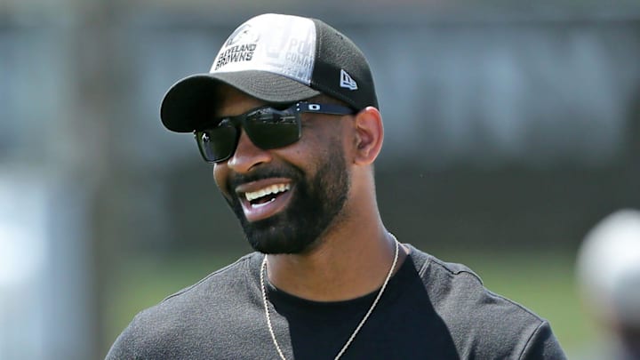 Browns general manager Andrew Berry, right, shares a laugh with cornerback Justin Hardee Sr. after minicamp practice June 13, 2024, in Berea.