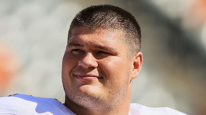 Oct 6, 2024; Cincinnati, Ohio, USA; Baltimore Ravens center Tyler Linderbaum (64) during warmups before the game against the Cincinnati Bengals at Paycor Stadium. Mandatory Credit: Katie Stratman-Imagn Images