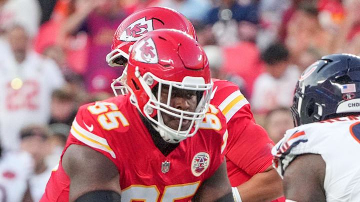 Aug 22, 2025; Kansas City, Missouri, USA; Kansas City Chiefs guard Trey Smith (65) lines up against Chicago Bears defensive tackle Gervon Dexter Sr. (99) during the game at GEHA Field at Arrowhead Stadium. Mandatory Credit: Denny Medley-Imagn Images