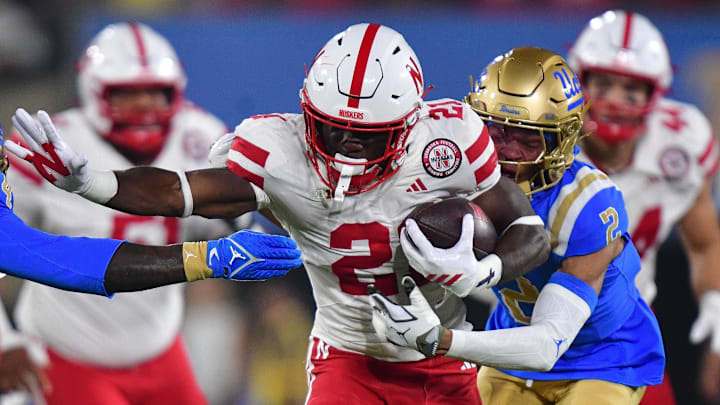 Nebraska Cornhuskers running back Emmett Johnson runs the ball against the UCLA Bruins.