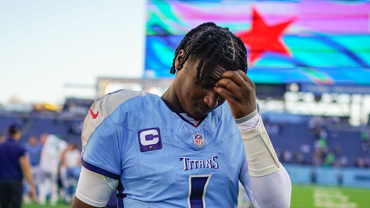 Nov 23, 2025; Nashville, Tennessee, USA; Tennessee Titans quarterback Cam Ward (1) exits the field after the game against the Seattle Seahawks  at Nissan Stadium. Mandatory Credit: Andrew Nelles-USA TODAY Network via Imagn Images