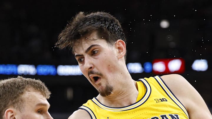 Michigan Wolverines center Aday Mara goes to the basket against Wisconsin Badgers forward Aleksas Bieliauskas.