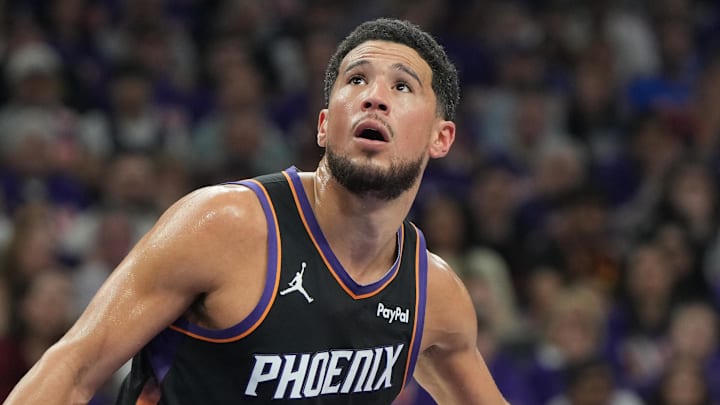 Apr 25, 2026; Phoenix, Arizona, USA; Phoenix Suns guard Devin Booker (1) blocks out against the Oklahoma City Thunder in the first half during game three of the first round of the 2026 NBA Playoffs at Mortgage Matchup Center. Mandatory Credit: Rick Scuteri-Imagn Images