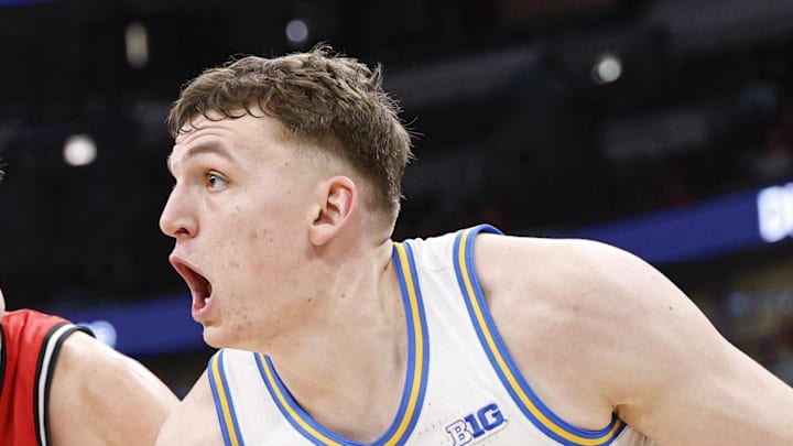 Mar 12, 2026; Chicago, IL, USA; UCLA Bruins forward Tyler Bilodeau (34) drives to the basket against Rutgers Scarlet Knights guard Harun Zrno (13) during the second half at United Center. Mandatory Credit: Kamil Krzaczynski-Imagn Images