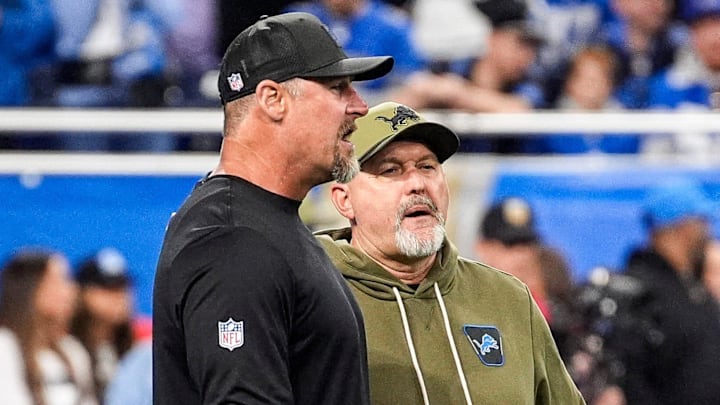 Detroit Lions head coach Dan Campbell talks to John Morton at warmup before Vikings game