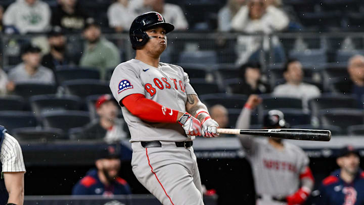 Boston Red Sox designated hitter Rafael Devers (11) reacts after hitting a home run 