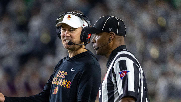 Oct 18, 2025; South Bend, Indiana, USA; Southern California Trojans head coach Lincoln Riley talks to an official during the first half against the Notre Dame Fighting Irish at Notre Dame Stadium. Mandatory Credit: Michael Caterina-Imagn Images