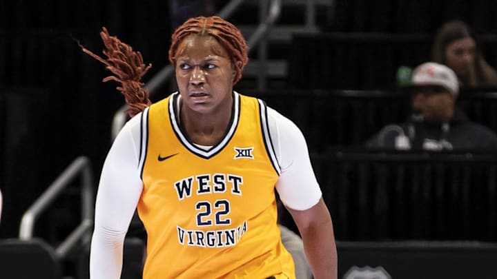 Mar 7, 2026; Kansas City, MO, USA; West Virginia Mountaineers forward Kierra Wheeler (22) celebrates a score during the first half at T-Mobile Center. Mandatory Credit: Nick Tre. Smith-Imagn Images Mar 7, 2026; Kansas City, MO, USA; West Virginia Mountaineers forward Kierra Wheeler (22) celebrates a score during the first half at T-Mobile Center. Mandatory Credit: Nick Tre. Smith-Imagn Images