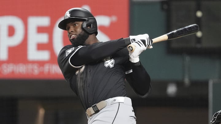 Chicago White Sox outfielder Luis Robert Jr. (88) swings against the Texas Rangers at Globe Life Field. 