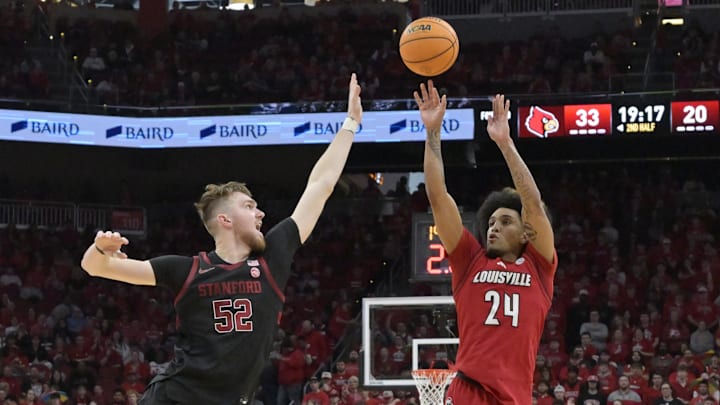 Mar 8, 2025; Louisville, Kentucky, USA;  Louisville Cardinals guard Chucky Hepburn (24) shoots against Stanford Cardinal forward Aidan Cammann (52) during the second half at KFC Yum! Center. Louisville defeated Stanford 68-48. Mandatory Credit: Jamie Rhodes-Imagn Images