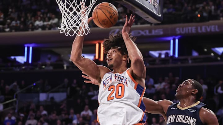 Dec 1, 2024; New York, New York, USA;  New York Knicks center Jericho Sims (20) gets the rebound in front of New Orleans Pelicans center Trey Jemison III (55) in the fourth quarter at Madison Square Garden. Mandatory Credit: Wendell Cruz-Imagn Images
