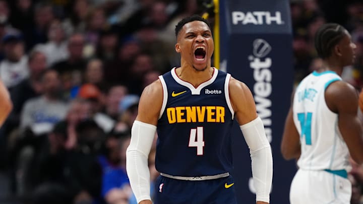 Feb 20, 2025; Denver, Colorado, USA; Denver Nuggets guard Russell Westbrook (4) reacts to his score in the second quarter against the Charlotte Hornets at Ball Arena. Mandatory Credit: Ron Chenoy-Imagn Images
