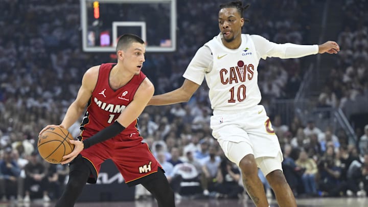 Apr 20, 2025; Cleveland, Ohio, USA; Cleveland Cavaliers guard Darius Garland (10) defends Miami Heat guard Tyler Herro (14) in the first quarter at Rocket Arena. Mandatory Credit: David Richard-Imagn Images