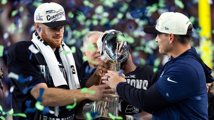 Seattle Seahawks head coach Mike Macdonald and quarterback Sam Darnold celebrate with the Vince Lombardi trophy. Seattle Seahawks head coach Mike Macdonald and quarterback Sam Darnold celebrate with the Vince Lombardi trophy.