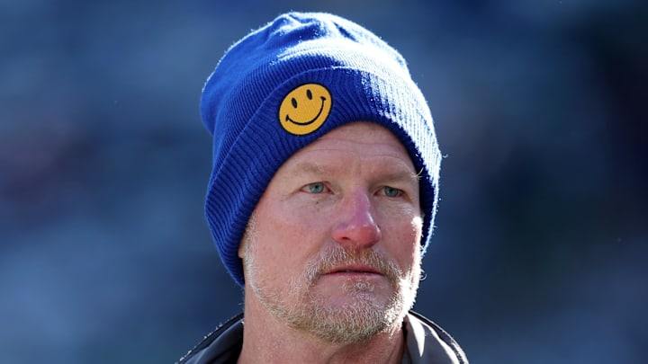 Dec 22, 2024; East Rutherford, New Jersey, USA; Los Angeles Rams general manager Les Snead watches his team warm up before a game against the New York Jets at MetLife Stadium. Mandatory Credit: Brad Penner-Imagn Images Dec 22, 2024; East Rutherford, New Jersey, USA; Los Angeles Rams general manager Les Snead watches his team warm up before a game against the New York Jets at MetLife Stadium. Mandatory Credit: Brad Penner-Imagn Images