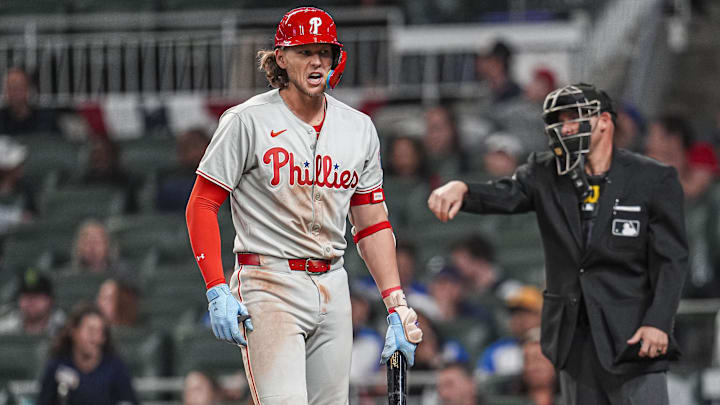 Apr 9, 2025; Cumberland, Georgia, USA; Philadelphia Phillies third base Alec Bohm (28) reacts after being called out on strikes against the Atlanta Braves during the ninth inning at Truist Park. 