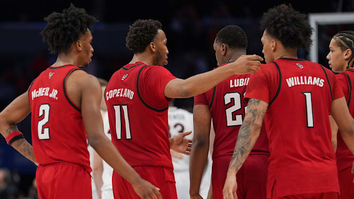 Mar 12, 2026; Charlotte, NC, USA; NC State Wolfpack players react to the loss during the second half against the Virginia Cavaliers at Spectrum Center. Mandatory Credit: Jim Dedmon-Imagn Images Mar 12, 2026; Charlotte, NC, USA; NC State Wolfpack players react to the loss during the second half against the Virginia Cavaliers at Spectrum Center. Mandatory Credit: Jim Dedmon-Imagn Images