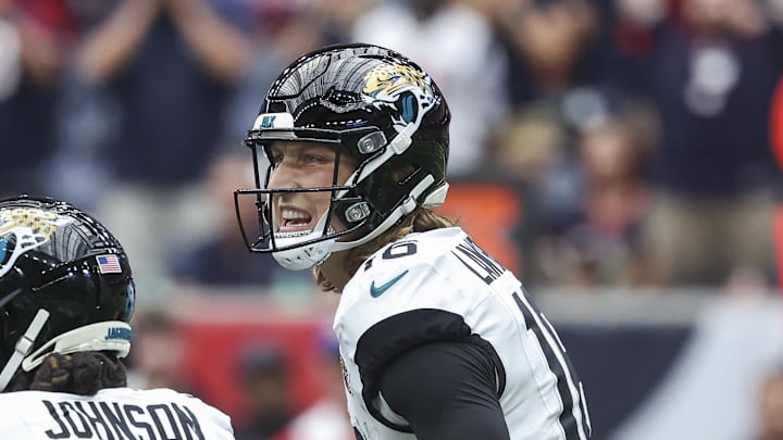 Sep 29, 2024; Houston, Texas, USA; Jacksonville Jaguars quarterback Trevor Lawrence (16) calls a play at the line of scrimmage during the fourth quarter against the Houston Texans at NRG Stadium. Mandatory Credit: Troy Taormina-Imagn Images