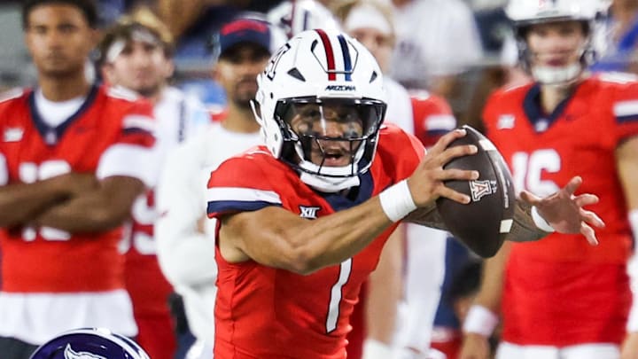 Sep 6, 2025; Tucson, Arizona, USA; Weber State Wildcats safety Tamal Johnson (31) fails to tackle Arizona Wildcats quarterback Noah Fifita (1) during the second quarter of the game at Arizona Stadium. Mandatory Credit: Aryanna Frank-Imagn Images