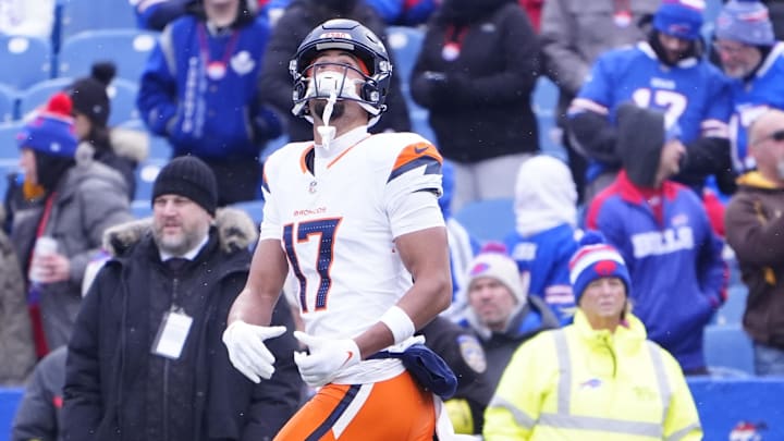 Jan 12, 2025; Orchard Park, New York, USA; Denver Broncos wide receiver Devaughn Vele (17) warms up before a game against the Buffalo Bills in an AFC wild card game at Highmark Stadium. Mandatory Credit: Gregory Fisher-Imagn Images Jan 12, 2025; Orchard Park, New York, USA; Denver Broncos wide receiver Devaughn Vele (17) warms up before a game against the Buffalo Bills in an AFC wild card game at Highmark Stadium. Mandatory Credit: Gregory Fisher-Imagn Images