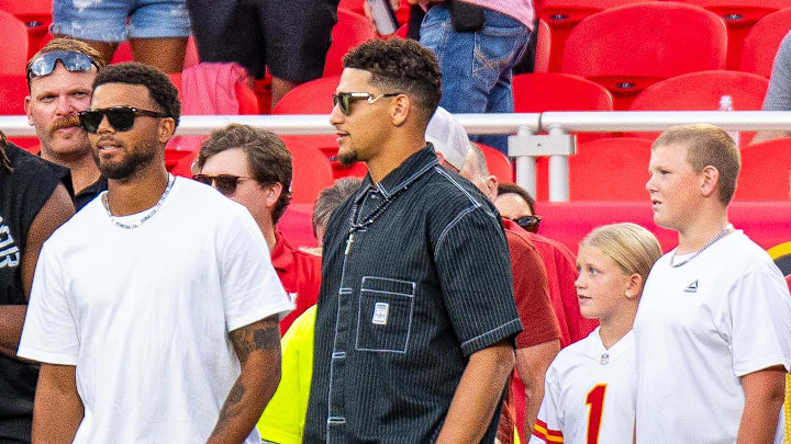 Kansas City Chiefs quarterback Patrick Mahomes watches warmups with teammates before the Nebraska-Cincinnati Game at Arrowhead Stadium.