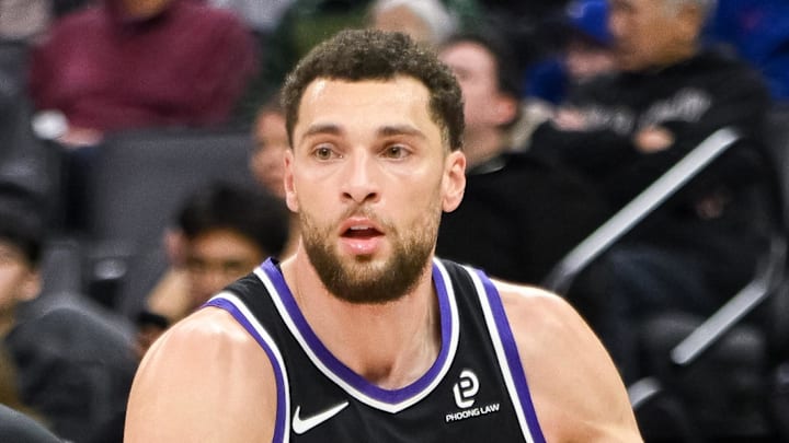 Feb 4, 2026; Sacramento, California, USA; Sacramento Kings guard Zach LaVine (8) dribbles past Memphis Grizzlies guard Kentavious Caldwell-Pope (3) during the third quarter at Golden 1 Center. Mandatory Credit: Ed Szczepanski-Imagn Images