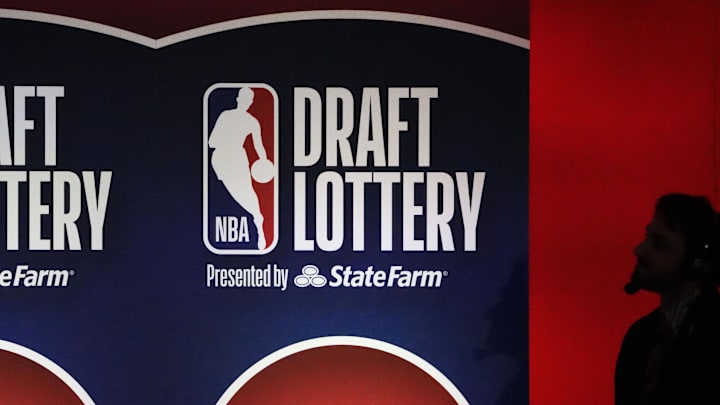May 12, 2025; Chicago, Illinois, US; A person watches the 2025 NBA Draft Lottery at McCormick Place. Mandatory Credit: David Banks-Imagn Images