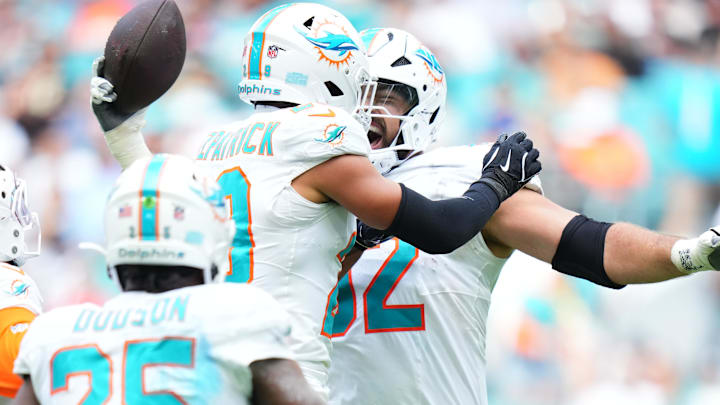 Nov 30, 2025; Miami Gardens, Florida, USA; Miami Dolphins defensive tackle Zach Sieler (92) reacts with safety Minkah Fitzpatrick (29) after forcing a fumble against the New Orleans Saints during the first half at Hard Rock Stadium. Mandatory Credit: Rich Storry-Imagn Images Nov 30, 2025; Miami Gardens, Florida, USA; Miami Dolphins defensive tackle Zach Sieler (92) reacts with safety Minkah Fitzpatrick (29) after forcing a fumble against the New Orleans Saints during the first half at Hard Rock Stadium. Mandatory Credit: Rich Storry-Imagn Images