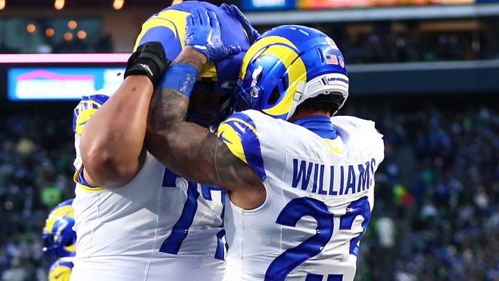 Los Angeles Rams running back Kyren Williams (23) celebrates with offensive tackle Alaric Jackson (77).. Mandatory Credit: Kevin Ng-Imagn Images