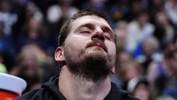 Mar 6, 2026; Denver, Colorado, USA; Denver Nuggets center Nikola Jokic (15) reacts on the bench during the fourth quarter against the New York Knicks at Ball Arena. Mandatory Credit: Ron Chenoy-Imagn Images