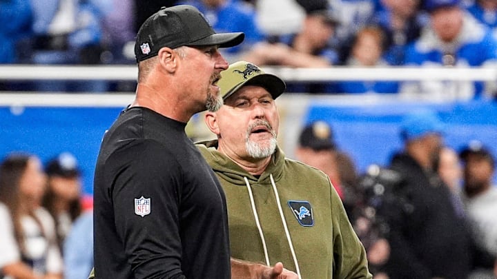 Detroit Lions head coach Dan Campbell talks to offensive coordinator John Morton at warmup ahead of the Minnesota Vikings game at Ford Field in Detroit on Sunday, November 2, 2025.