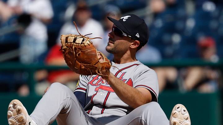 Apr 23, 2026; Washington, District of Columbia, USA; Atlanta Braves first baseman Matt Olson (28) sits on the dirt at first base after catching a throw to first base by Braves third baseman Austin Riley (not pictured) on a ground ball by Washington Nationals third baseman JosŽ Tena (not pictured) during the ninth inning at Nationals Park. Mandatory Credit: Geoff Burke-Imagn Images