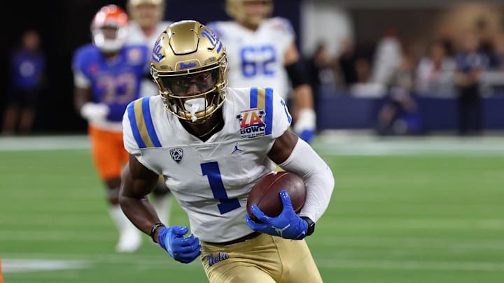 Dec 16, 2023; Inglewood, CA, USA; UCLA Bruins wide receiver J. Michael Sturdivant (1) runs with the ball after catching a pass against Boise State Broncos linebacker DJ Schramm (52) during the third quarter of the LA Bowl at SoFi Stadium. Mandatory Credit: Kiyoshi Mio-Imagn Images Dec 16, 2023; Inglewood, CA, USA; UCLA Bruins wide receiver J. Michael Sturdivant (1) runs with the ball after catching a pass against Boise State Broncos linebacker DJ Schramm (52) during the third quarter of the LA Bowl at SoFi Stadium. Mandatory Credit: Kiyoshi Mio-Imagn Images