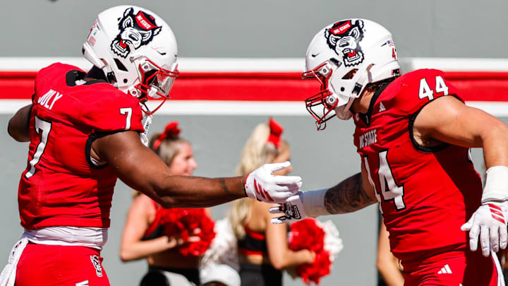Oct 4, 2025; Raleigh, North Carolina, USA; NC State Wolfpack tight end Justin Joly (7) and tight end Cody Hardy (44) celebrate a touchdown during the first half of the game against Campbell Fighting Camels at Carter-Finley Stadium. Mandatory Credit: Jaylynn Nash-Imagn Images Oct 4, 2025; Raleigh, North Carolina, USA; NC State Wolfpack tight end Justin Joly (7) and tight end Cody Hardy (44) celebrate a touchdown during the first half of the game against Campbell Fighting Camels at Carter-Finley Stadium. Mandatory Credit: Jaylynn Nash-Imagn Images