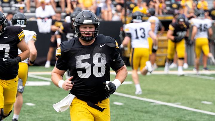 Iowa offensive lineman Kade Pieper (58) warms up Aug. 15, 2026 during the Kids Day at Kinnick open practice at Kinnick Stadium in Iowa City, Iowa.
