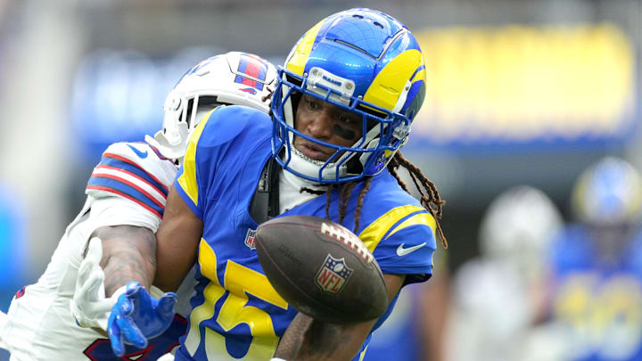 Dec 8, 2024; Inglewood, California, USA; Los Angeles Rams wide receiver Demarcus Robinson (15) attempts to catch the ball against Buffalo Bills cornerback Christian Benford (47) in the first half at SoFi Stadium. Mandatory Credit: Kirby Lee-Imagn Images